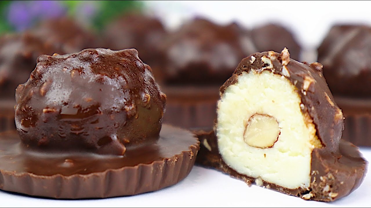 Glutenfreie Milchpulver-Schoko-Mandel-Trophäen — Hausgemachte schokoüberzogene Pralinen mit einer Milchpulver-Füllung um eine gan