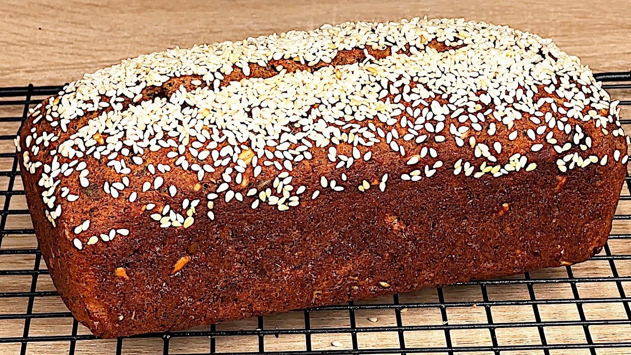 Red Lentil Zucchini Seeded Loaf with Pumpkin Seeds — Hearty red-lentil zucchini loaf with pumpkin and sunflower seeds, fragrant cherr
